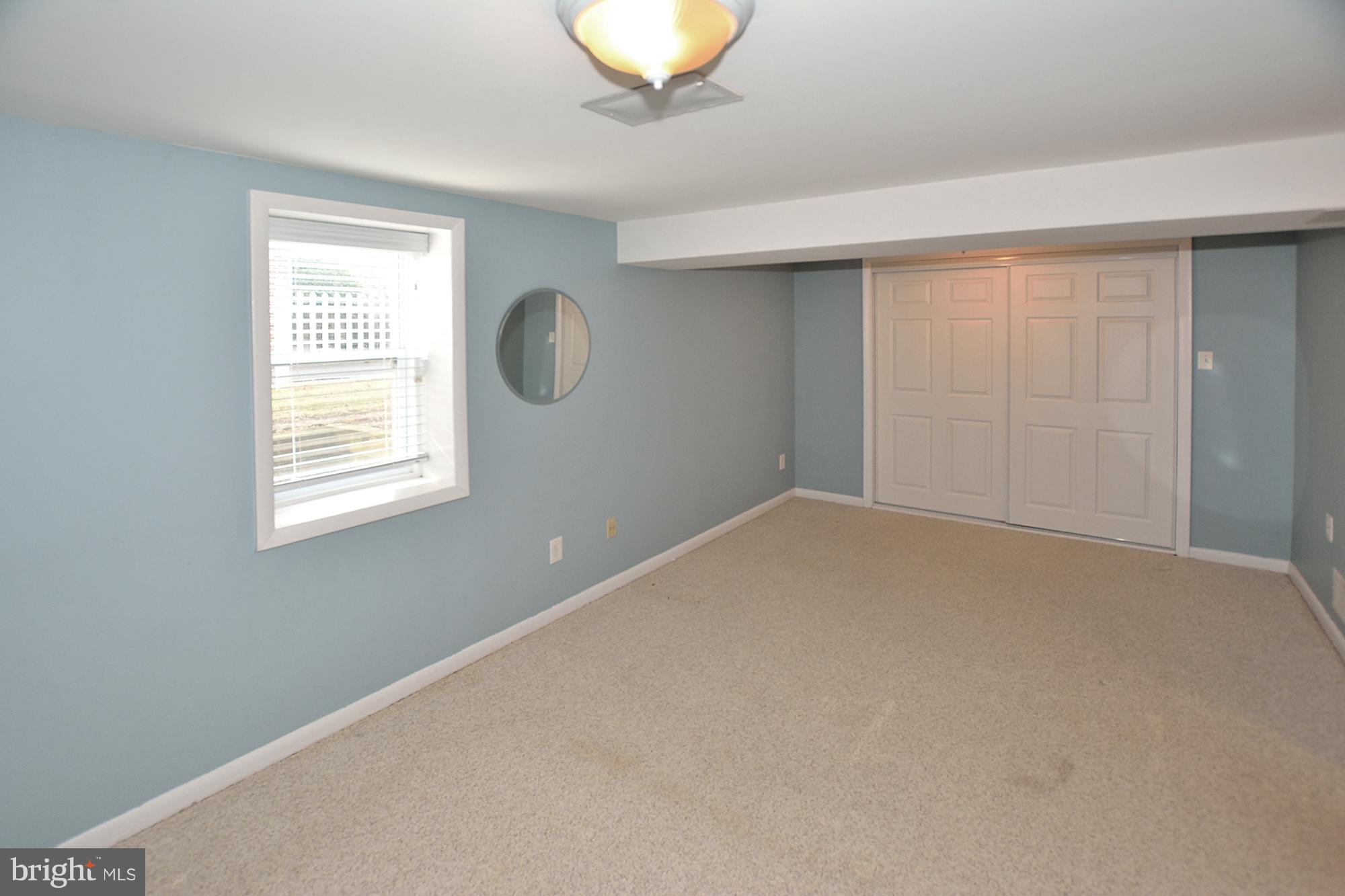 506 Tapawingo Road Southwest Vienna, VA 22180 - Photo 21 of 25 an empty room with a window and closet