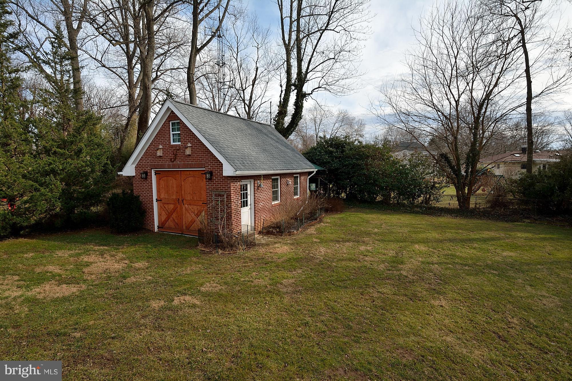 506 Tapawingo Road Southwest Vienna, VA 22180 - Photo 25 of 25 a house with huge green field in front of it