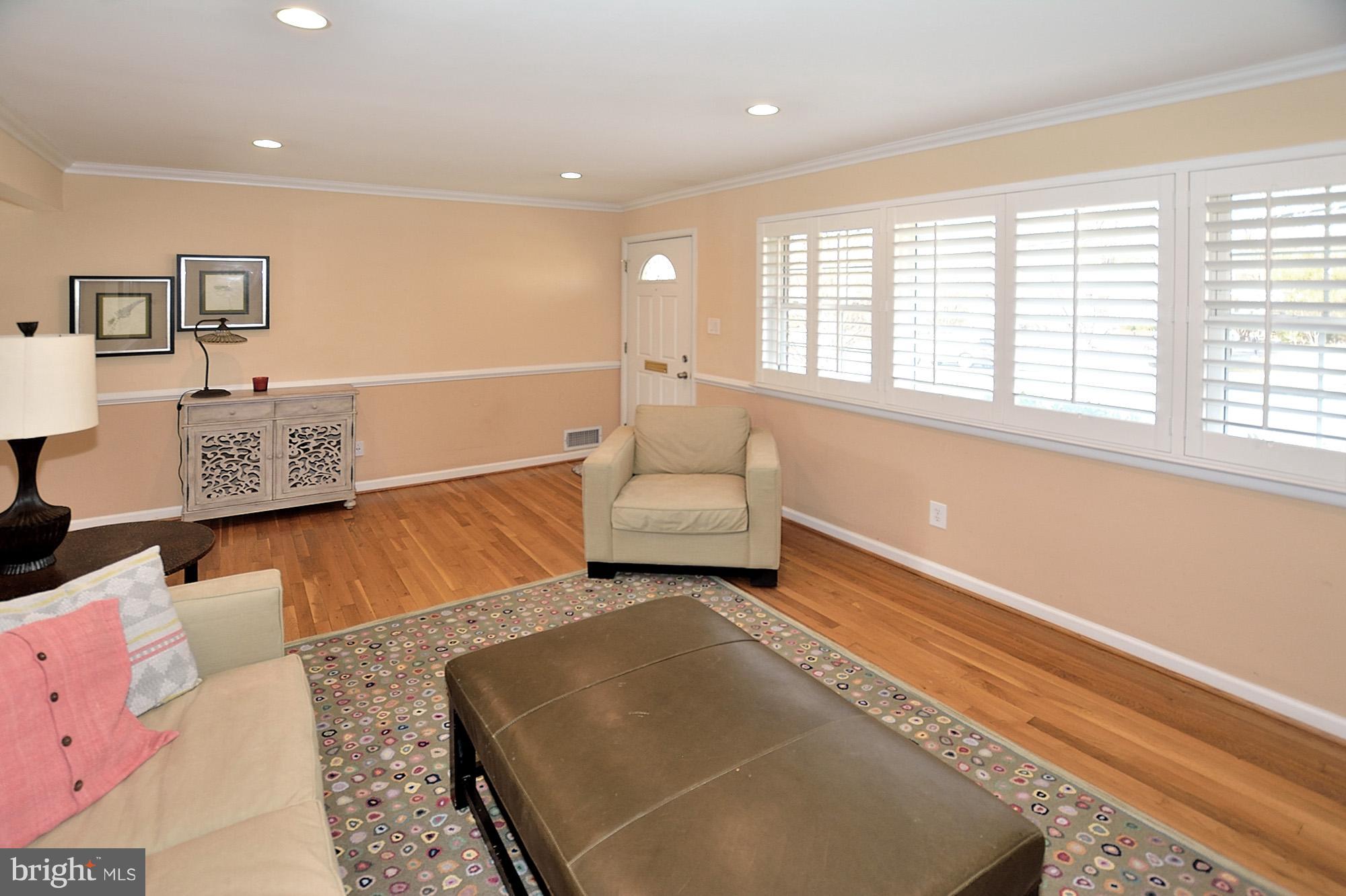506 Tapawingo Road Southwest Vienna, VA 22180 - Photo 4 of 25 a living room with furniture and a large window