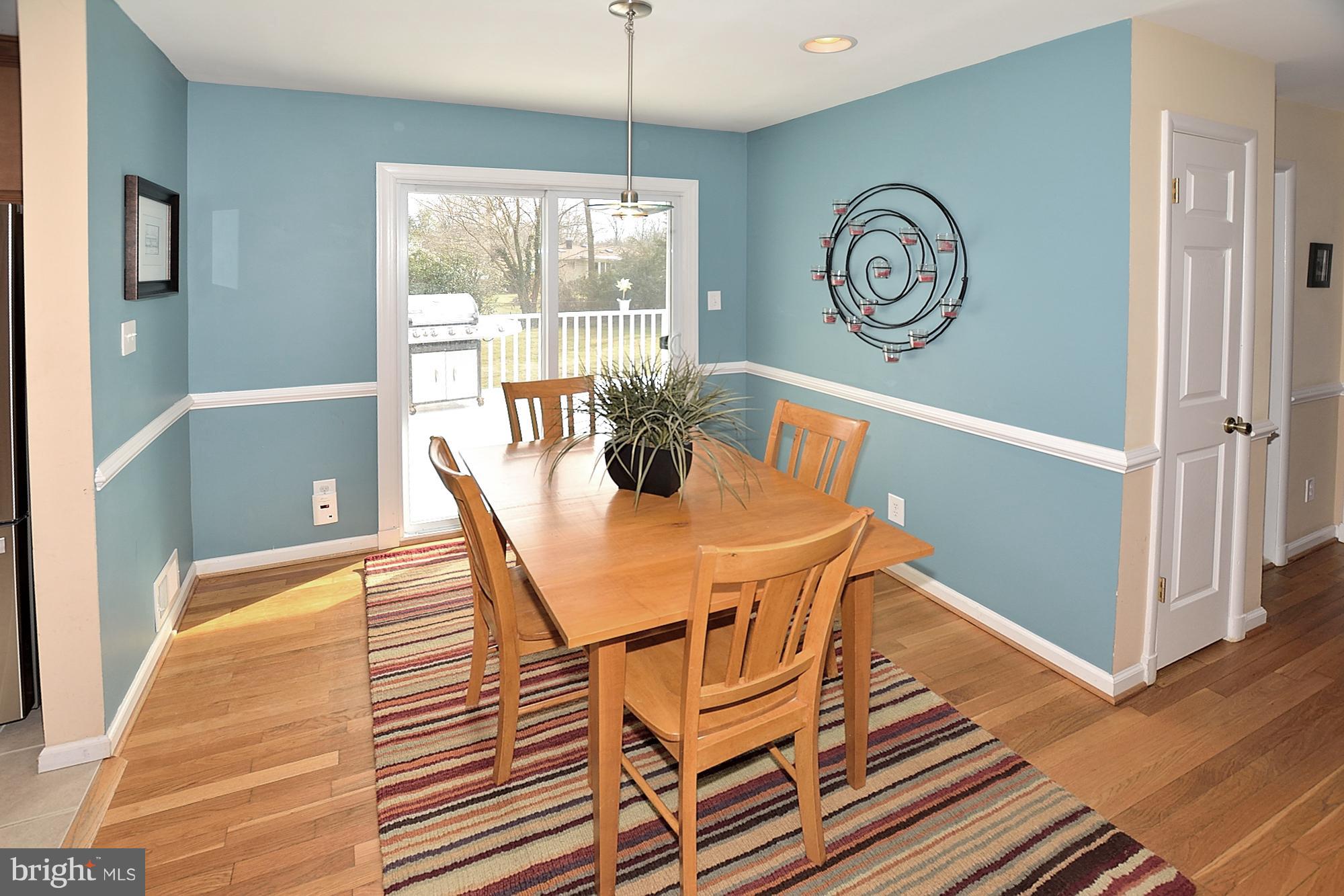 506 Tapawingo Road Southwest Vienna, VA 22180 - Photo 5 of 25 a view of a dining room with furniture window and wooden floor