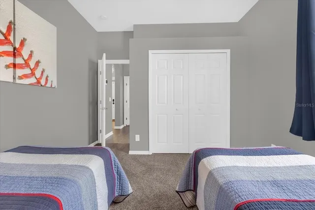 a bedroom with a bed and hallway