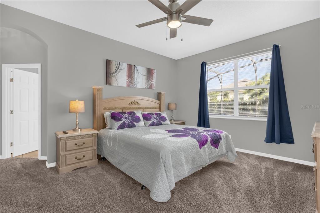 246 Montara Drive Davenport, FL 33897 - Photo 19 of 37 a bedroom with a bed and a window