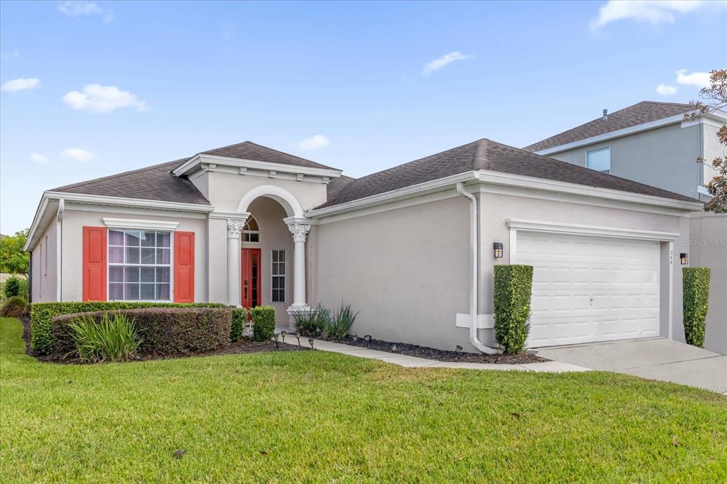 246 Montara Drive Davenport, FL 33897 - Photo 2 of 37 a front view of a house with garden