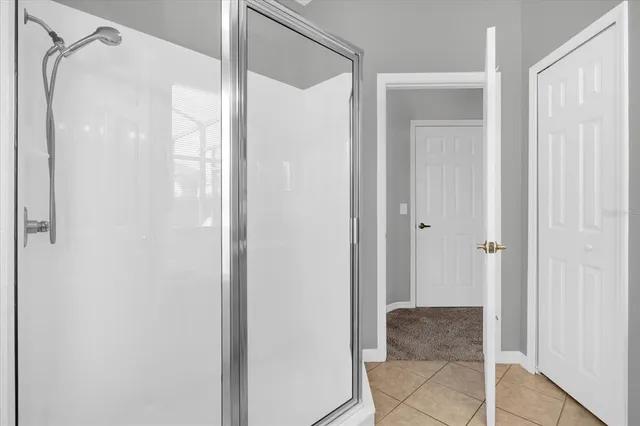a view of bathroom with shower door