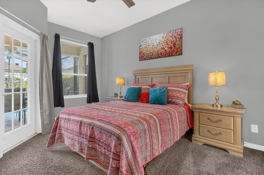 246 Montara Drive Davenport, FL 33897 - Photo 23 of 37 a bedroom with a bed a dresser and next to a window