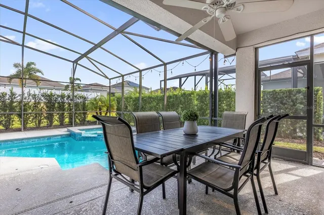 a view of a swimming pool with a patio