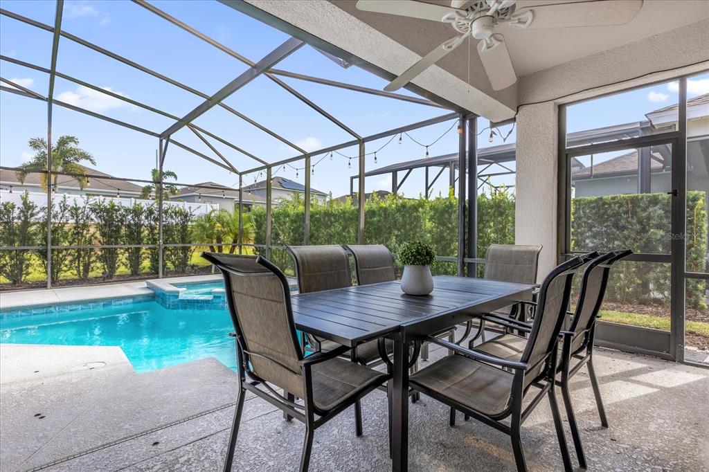 246 Montara Drive Davenport, FL 33897 - Photo 29 of 37 a view of a dining room with furniture window and outside view