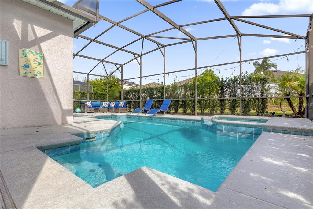 246 Montara Drive Davenport, FL 33897 - Photo 30 of 37 a view of a swimming pool with a patio