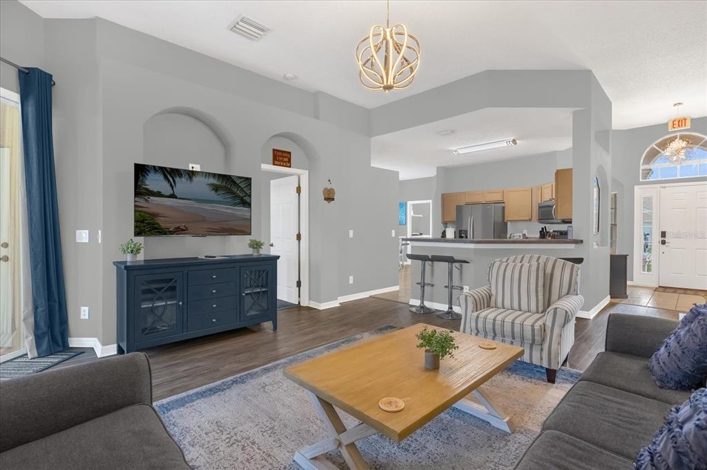 246 Montara Drive Davenport, FL 33897 - Photo 3 of 37 a living room with furniture and a flat screen tv