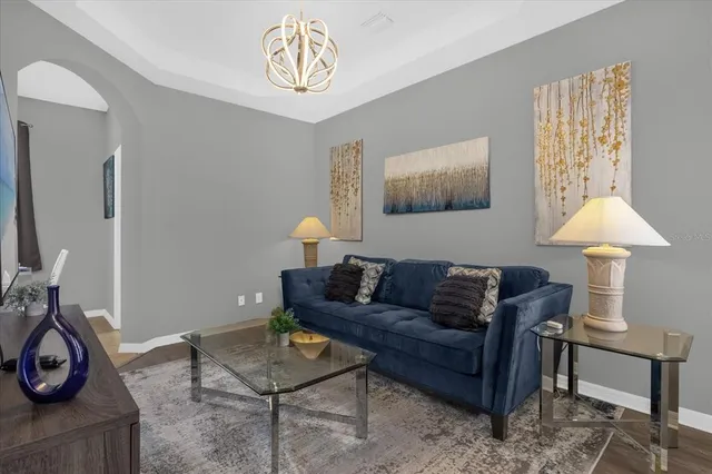 a living room with furniture and a window