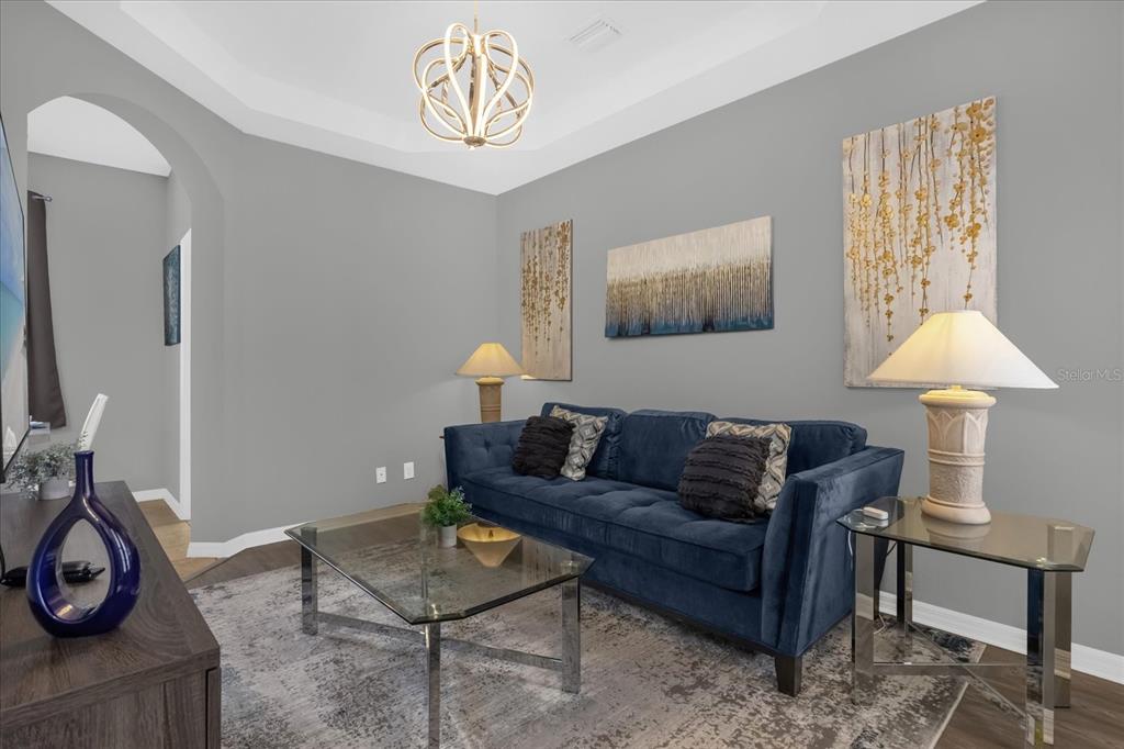 246 Montara Drive Davenport, FL 33897 - Photo 5 of 37 a living room with furniture and a window