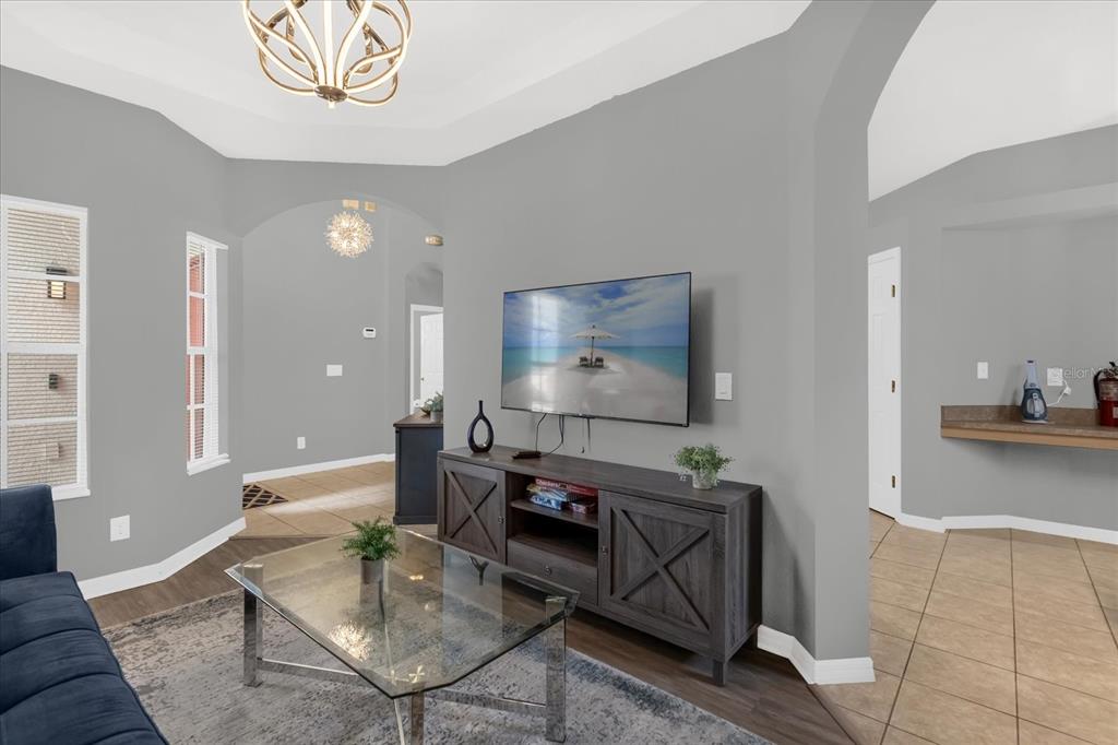 246 Montara Drive Davenport, FL 33897 - Photo 7 of 37 a living room with furniture and a flat screen tv