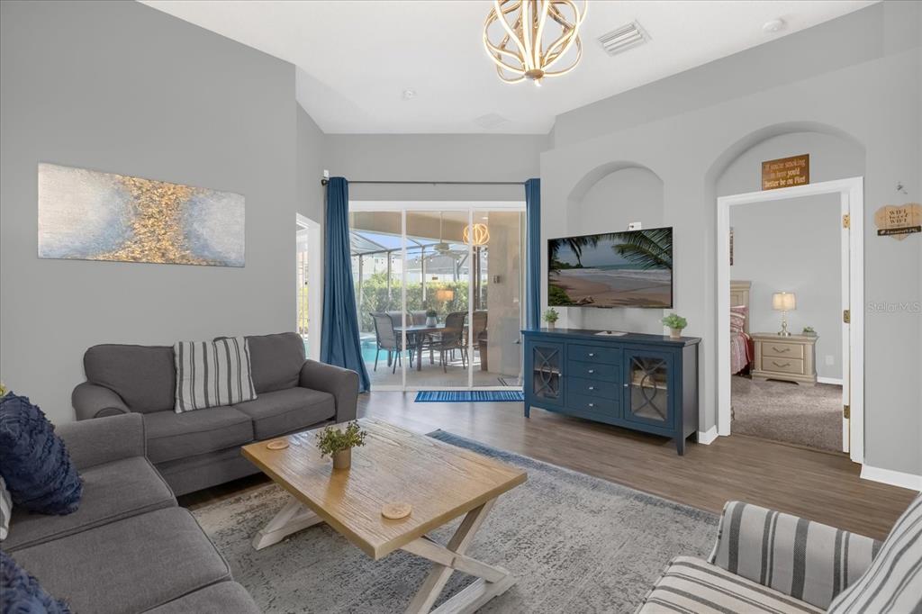 246 Montara Drive Davenport, FL 33897 - Photo 8 of 37 a living room with furniture and a flat screen tv