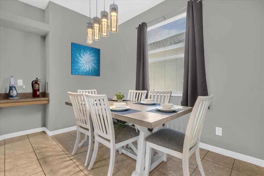 246 Montara Drive Davenport, FL 33897 - Photo 10 of 37 a dining room with furniture and window