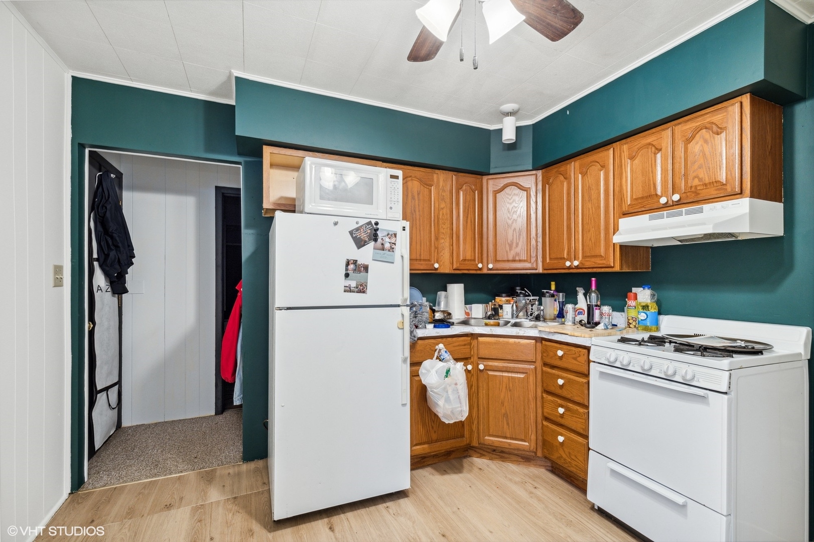 2415 Johnsburg Road Johnsburg, IL 60051 - Photo 4 of 9 a kitchen with refrigerator and cabinets