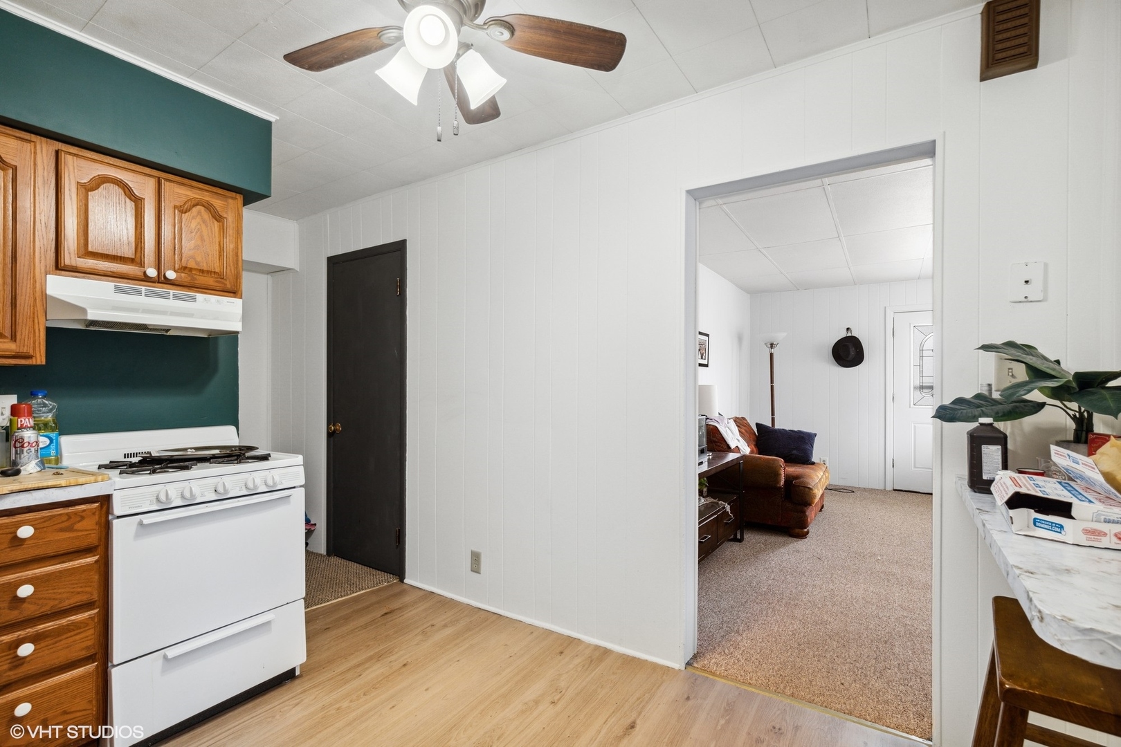 2415 Johnsburg Road Johnsburg, IL 60051 - Photo 5 of 9 a view of kitchen with stainless steel appliances kitchen island granite countertop a stove a sink and a refrigerator