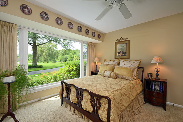 833 North Inverway Road Inverness, IL 60067 - Photo 18 of 25 a bedroom with a bed and a large window