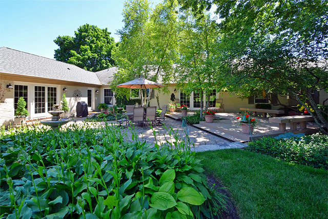 833 North Inverway Road Inverness, IL 60067 - Photo 24 of 25 a view of a patio with table and chairs under an umbrella