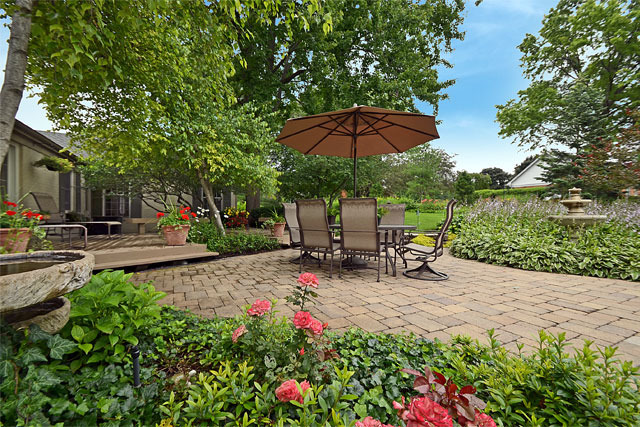 833 North Inverway Road Inverness, IL 60067 - Photo 25 of 25 a view of a backyard with table and chairs under an umbrella