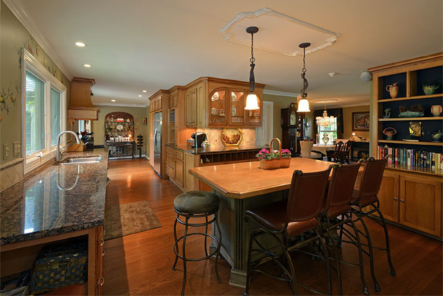 833 North Inverway Road Inverness, IL 60067 - Photo 5 of 25 a dining table chairs and a book shelf
