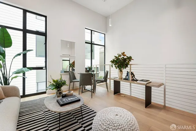 a dining room with furniture and wooden floor