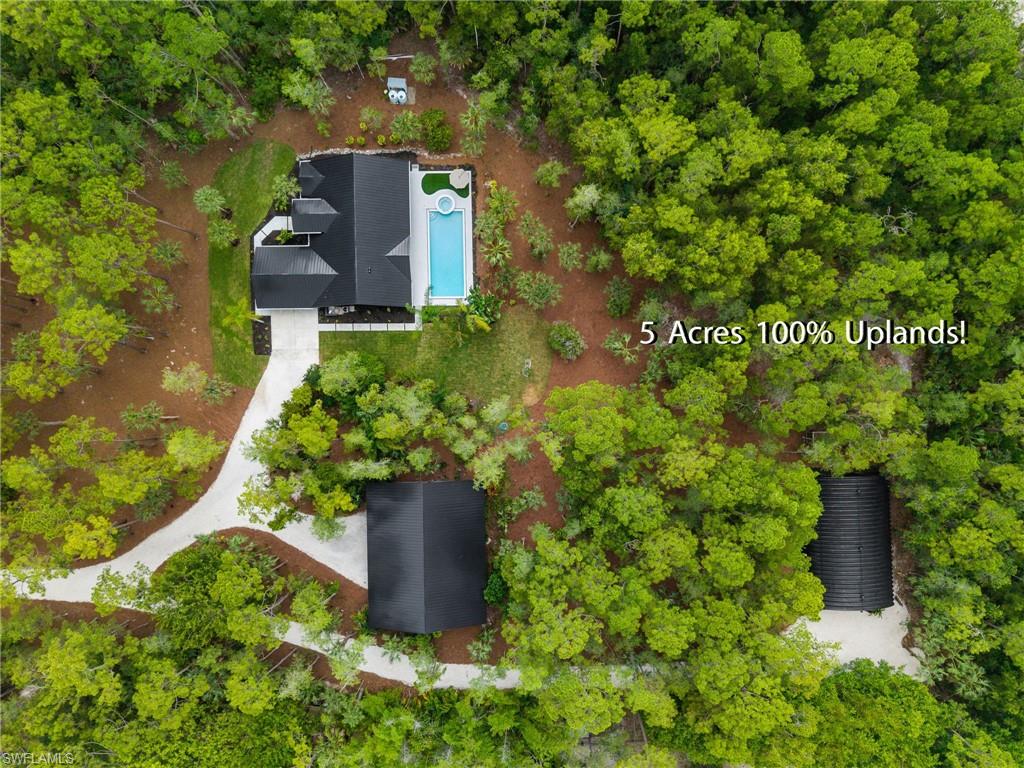4521 3rd Avenue Northwest Naples, FL 34119 - Photo 43 of 46 an aerial view of a house with a yard