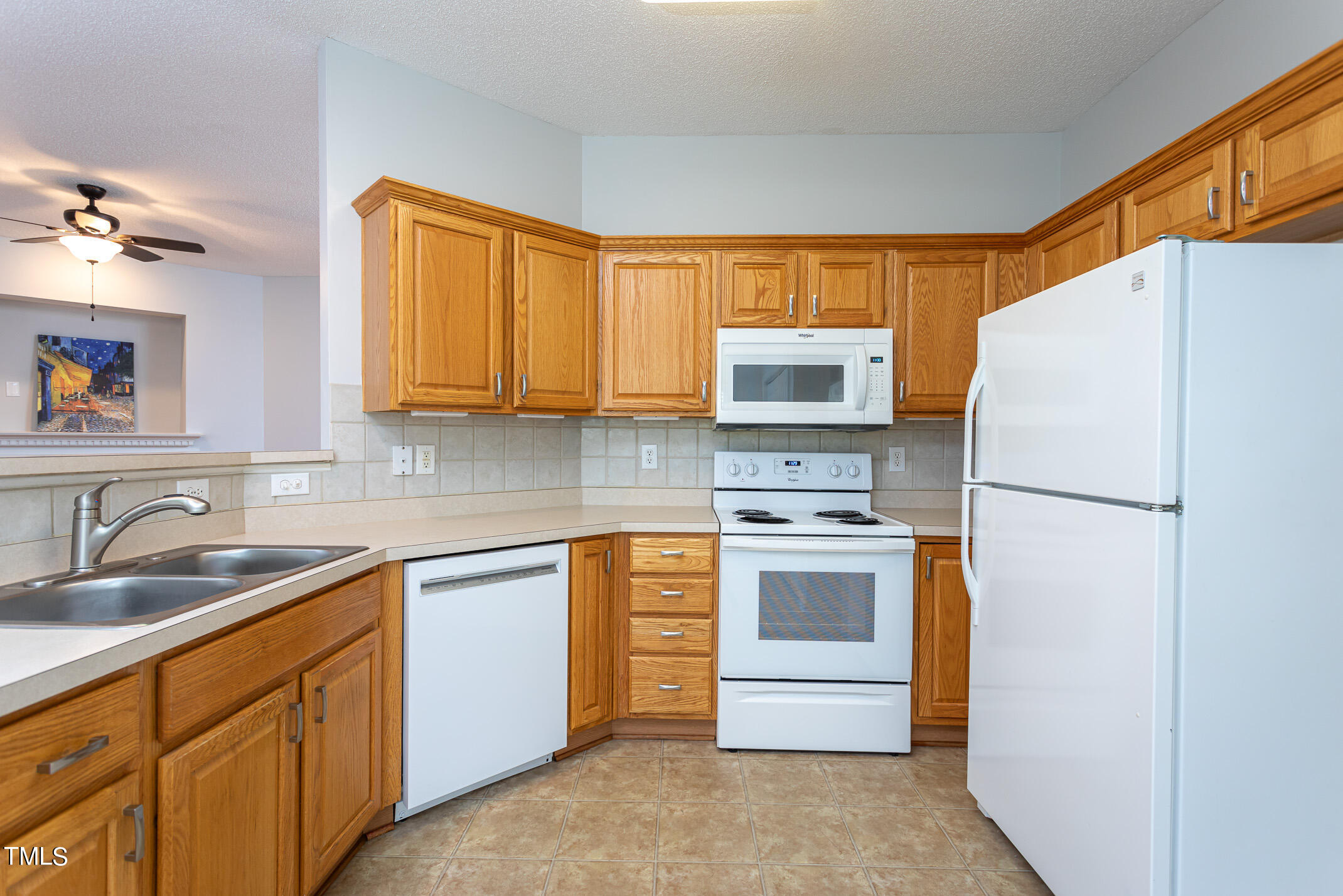 2548 Bent Green Street Raleigh, NC 27614 - Photo 13 of 28 a kitchen with stainless steel appliances granite countertop a refrigerator stove a sink and dishwasher