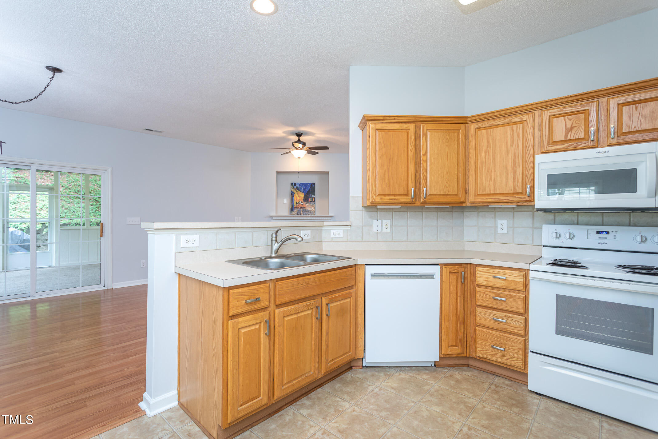 2548 Bent Green Street Raleigh, NC 27614 - Photo 14 of 28 a kitchen with a sink stove and microwave