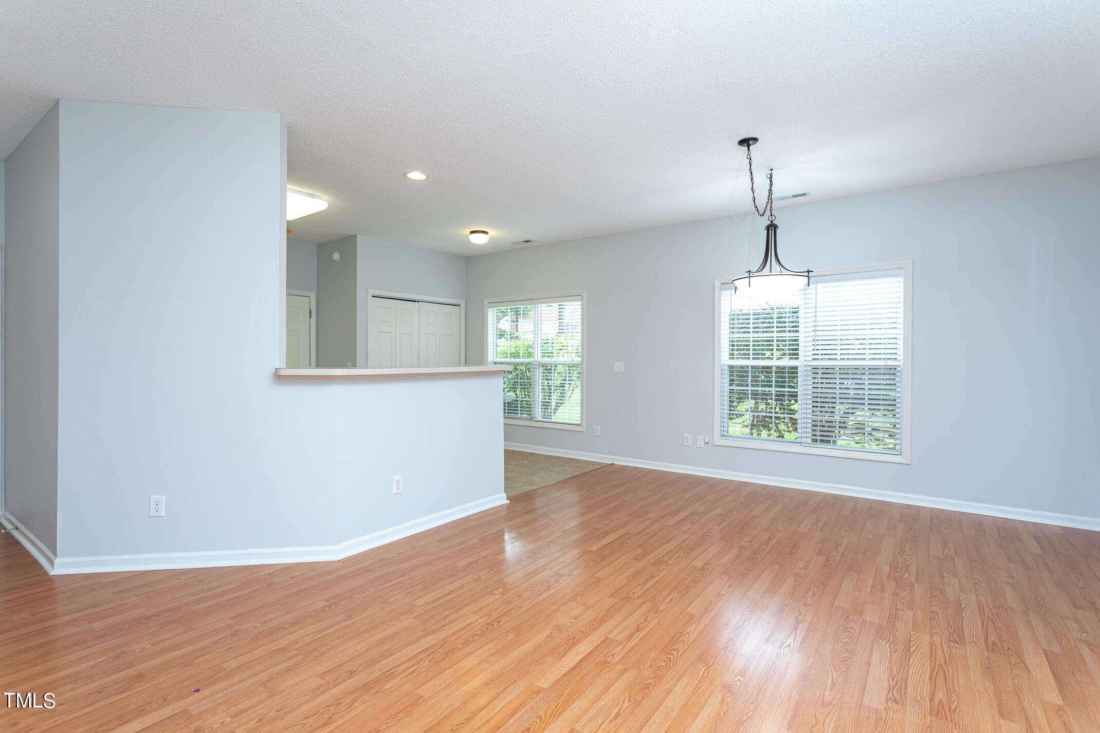 2548 Bent Green Street Raleigh, NC 27614 - Photo 17 of 28 an empty room with wooden floor and windows