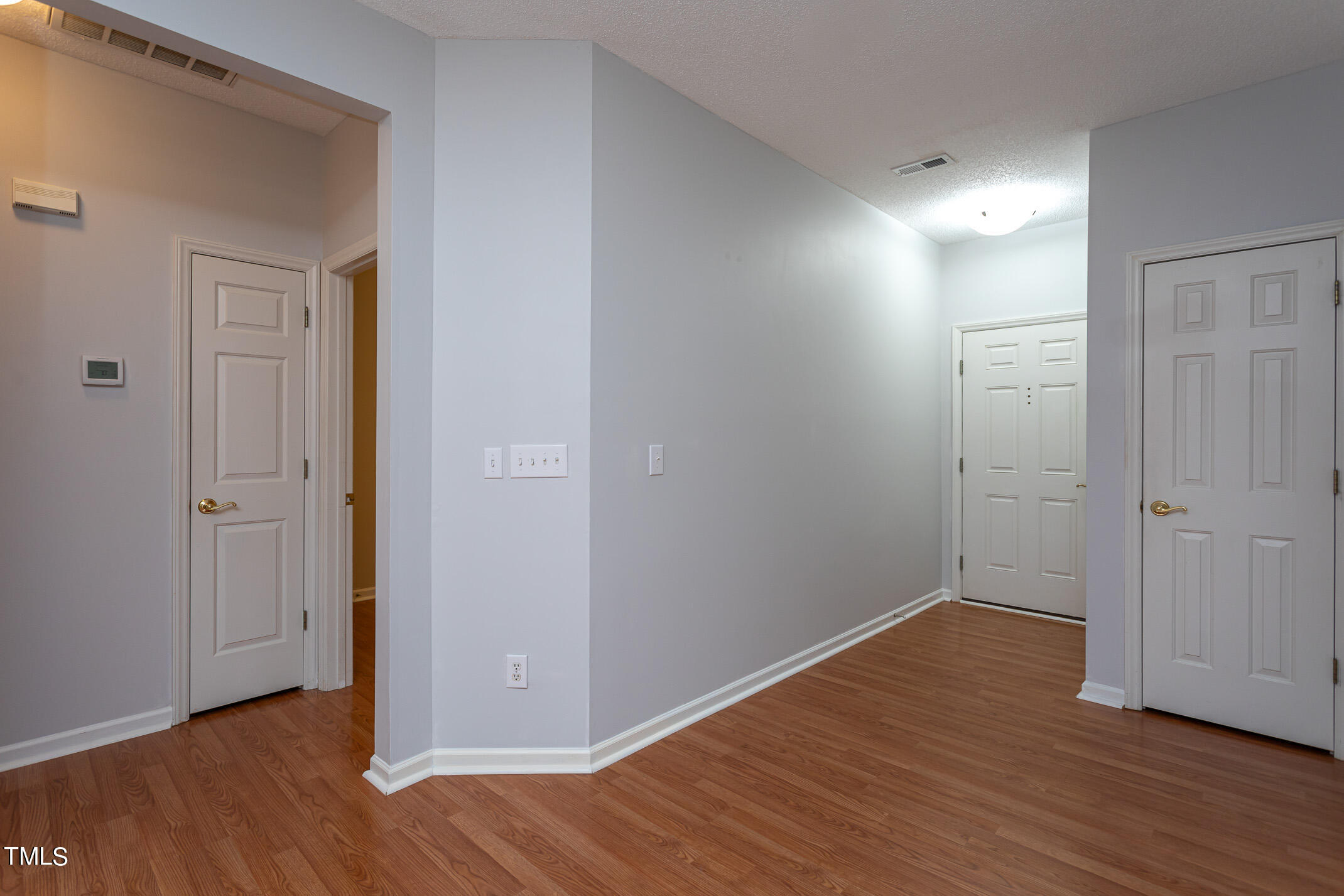 2548 Bent Green Street Raleigh, NC 27614 - Photo 18 of 28 a view of an empty room with wooden floor