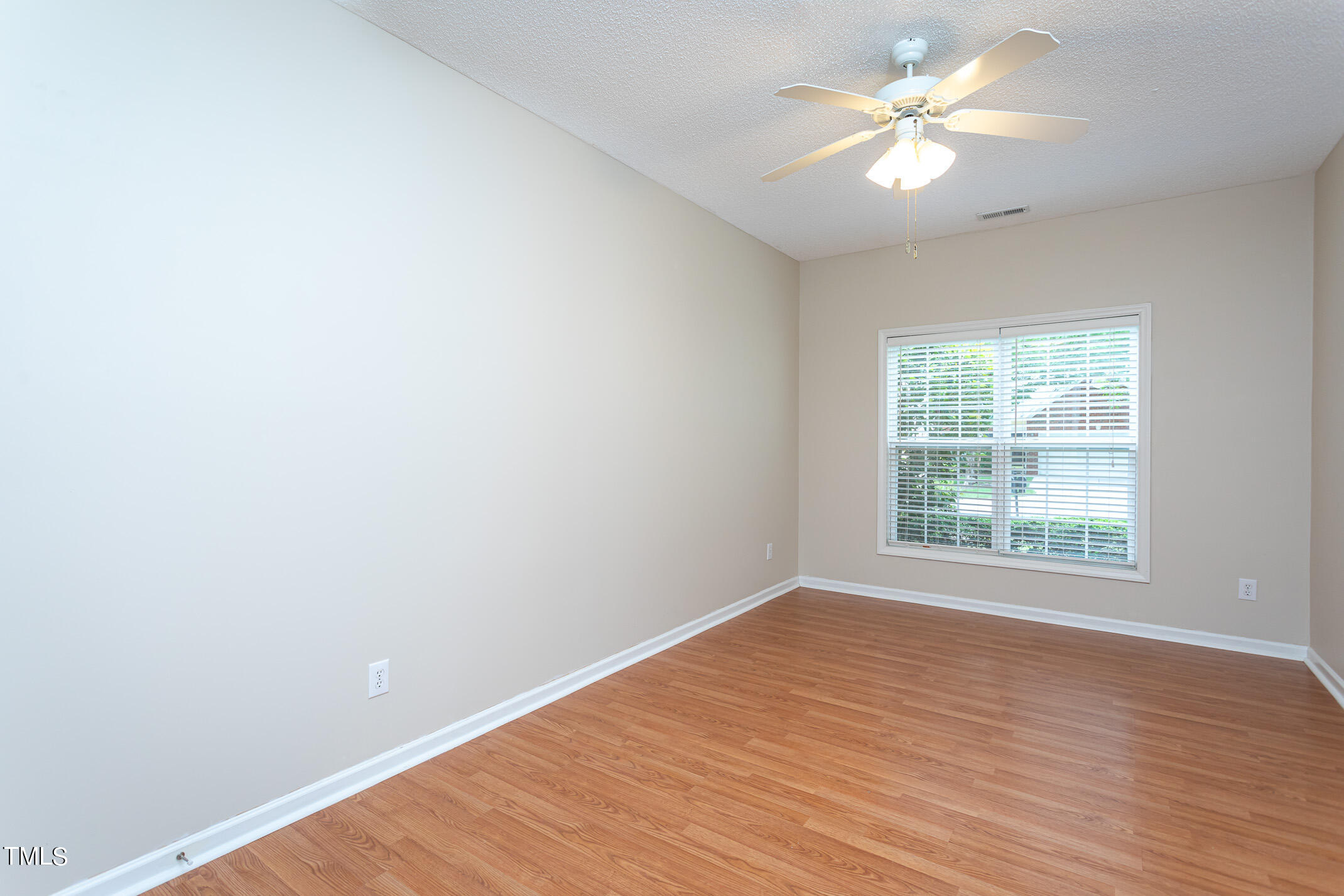 2548 Bent Green Street Raleigh, NC 27614 - Photo 19 of 28 wooden floor in an empty room with a window