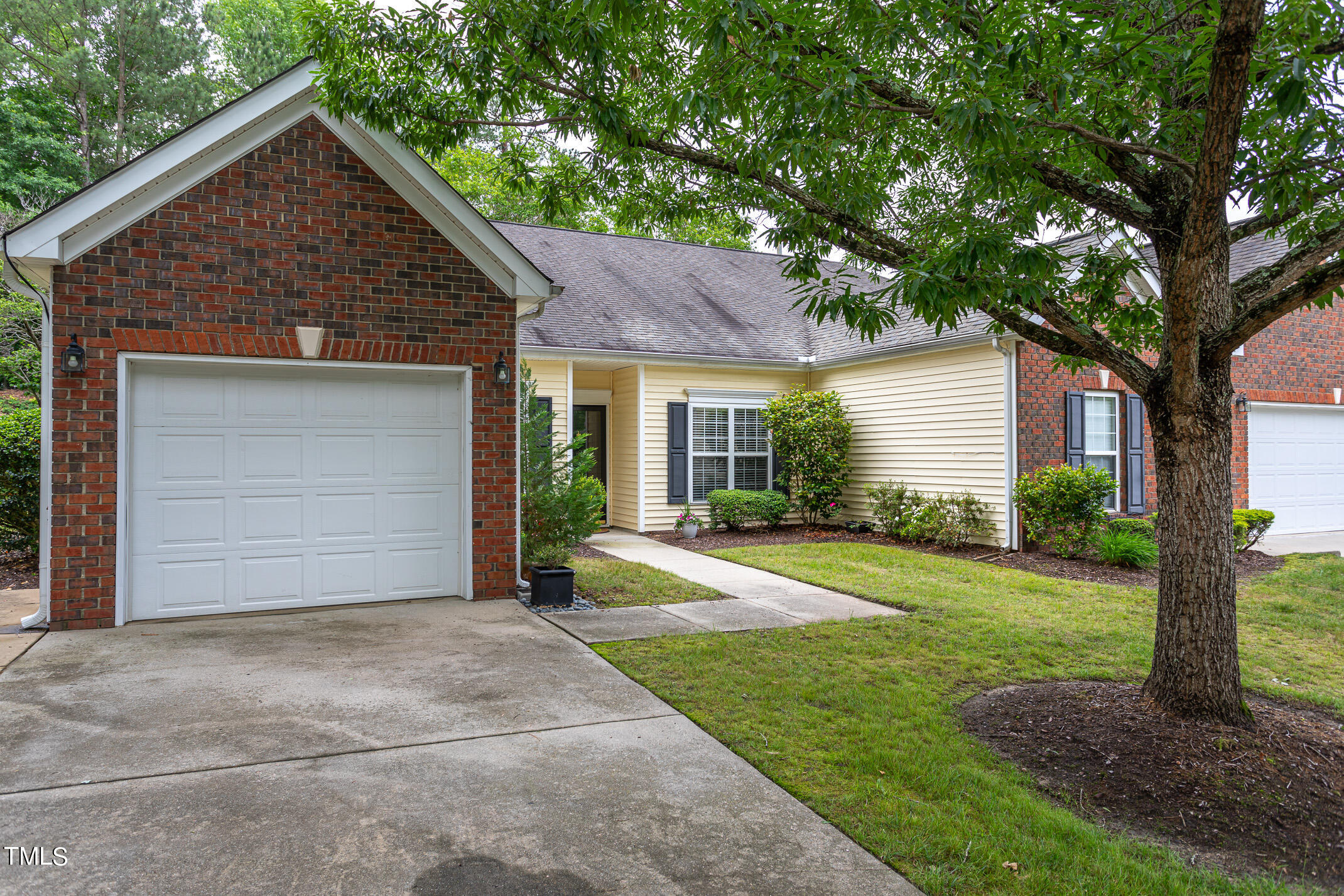 2548 Bent Green Street Raleigh, NC 27614 - Photo 4 of 28 a front view of a house with a yard and garage