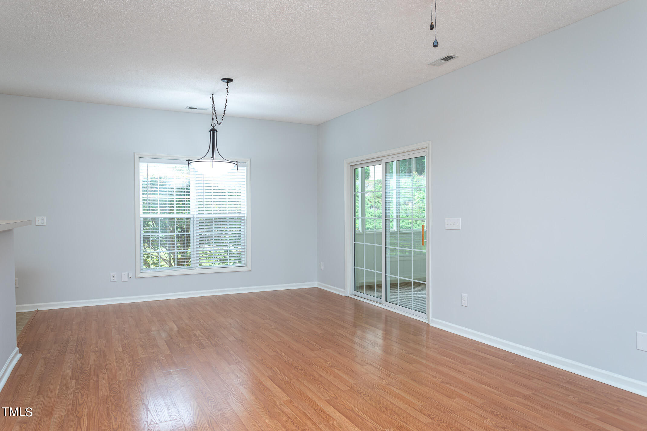 2548 Bent Green Street Raleigh, NC 27614 - Photo 8 of 28 wooden floor in an empty room with a window