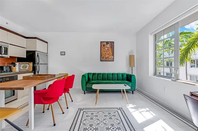 a balcony with furniture and a potted plant