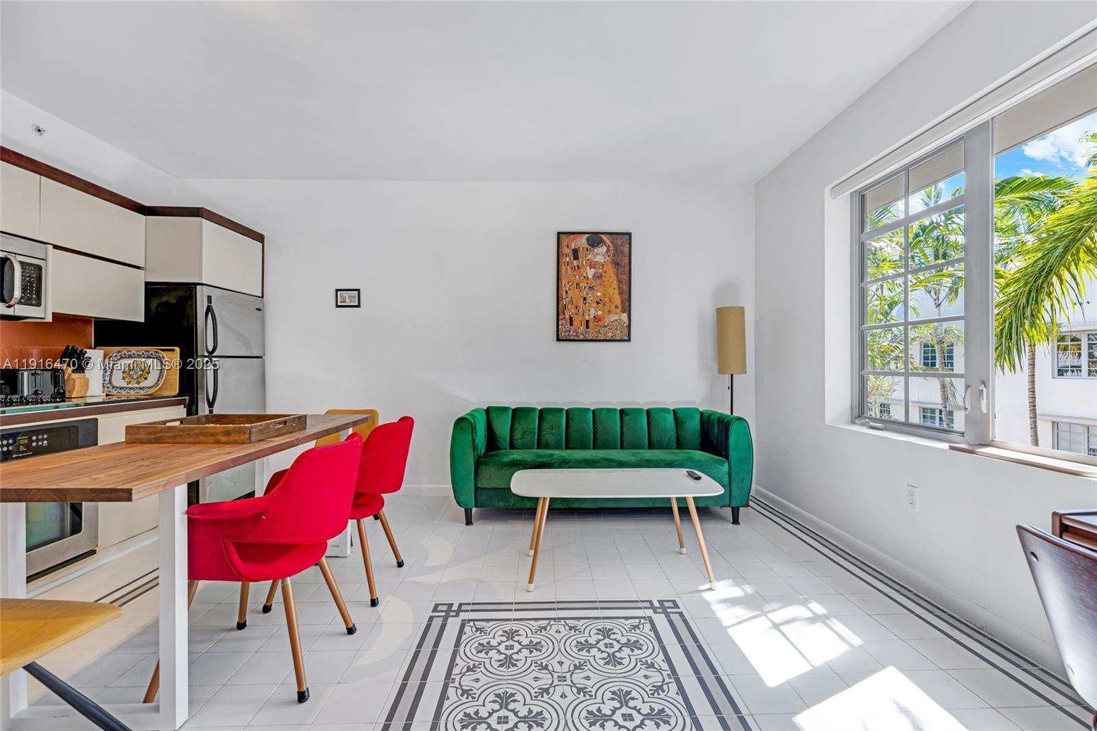 435 21st Street, Unit 311 Miami Beach, FL 33139 - Photo 1 of 40 a balcony with furniture and a potted plant