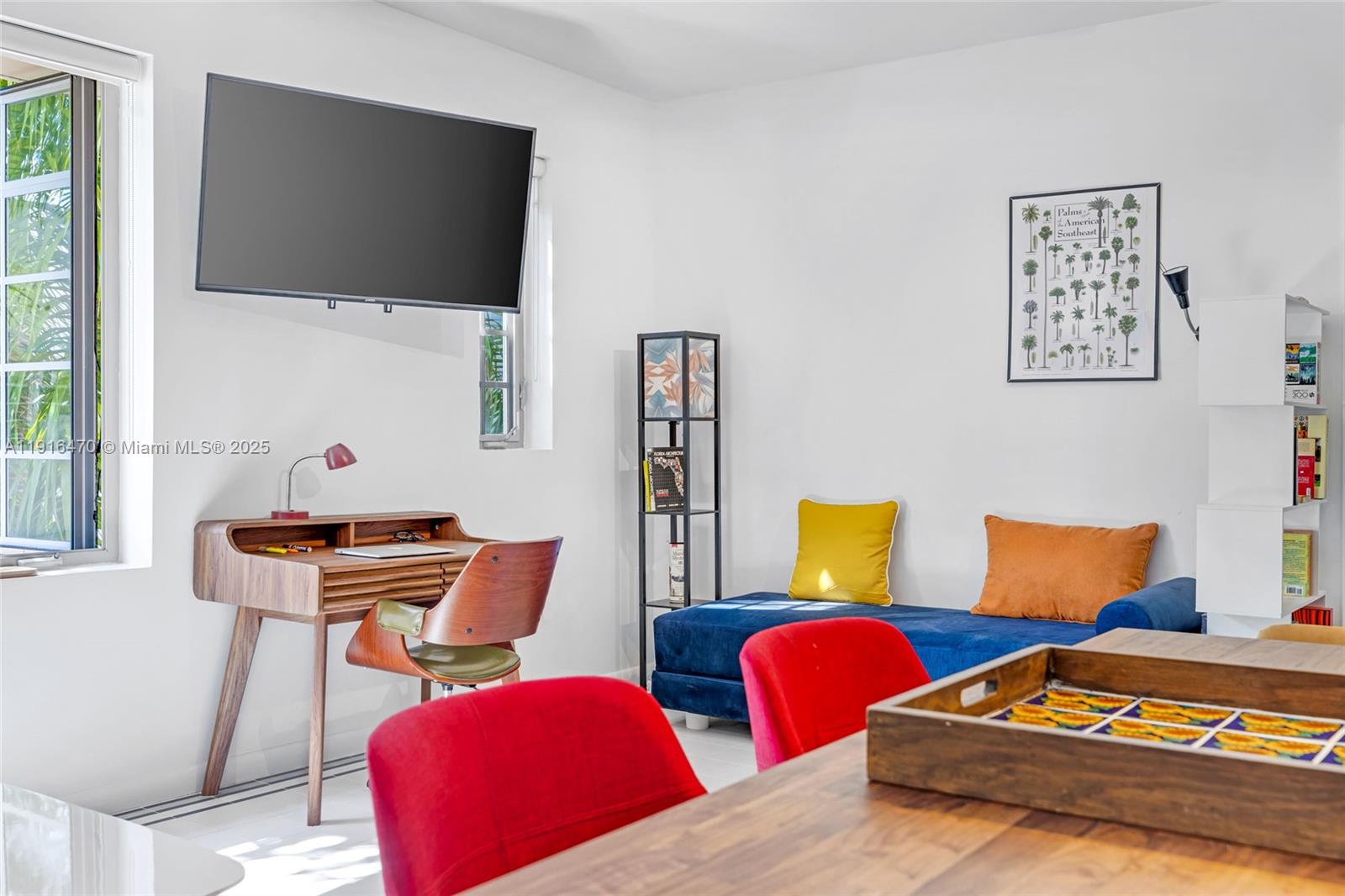 435 21st Street, Unit 311 Miami Beach, FL 33139 - Photo 15 of 40 a living room with furniture and a flat screen tv