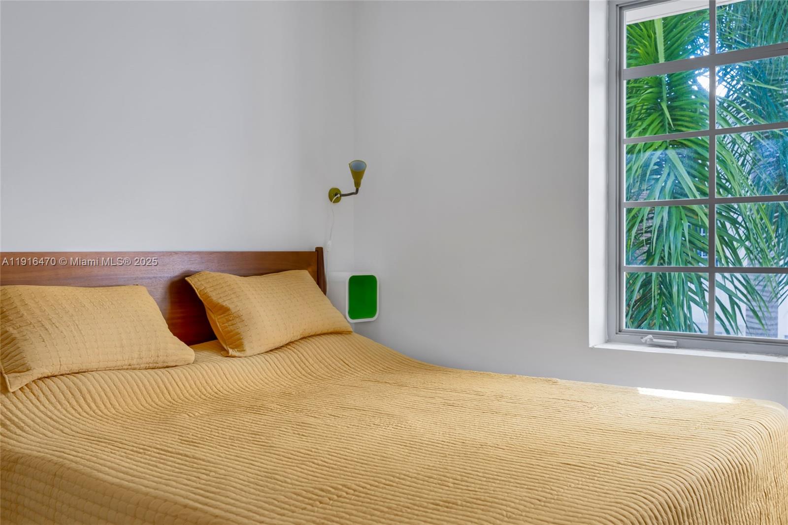 435 21st Street, Unit 311 Miami Beach, FL 33139 - Photo 25 of 40 a bedroom with a bed and a window
