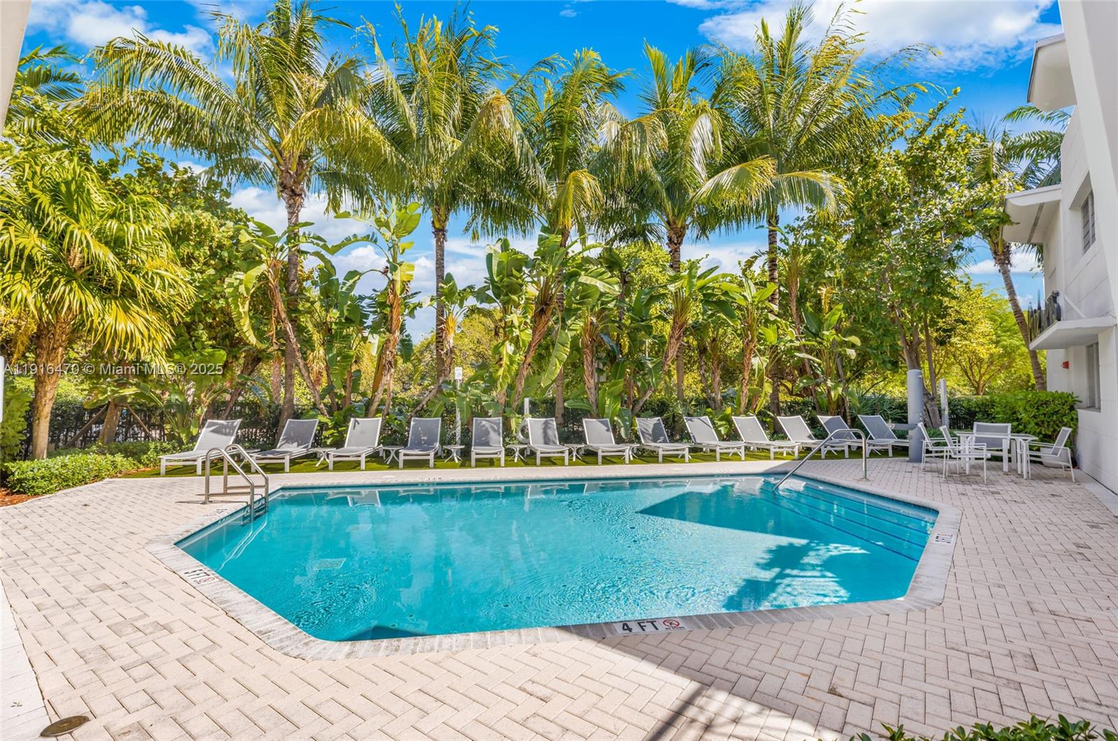 435 21st Street, Unit 311 Miami Beach, FL 33139 - Photo 32 of 40 a view of a swimming pool with a patio
