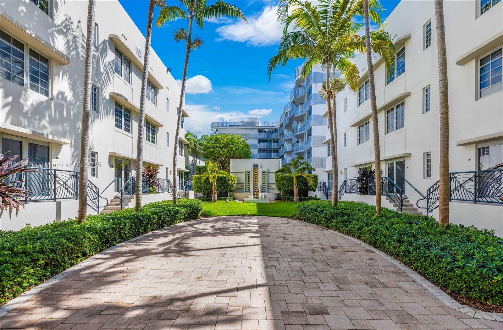 435 21st Street, Unit 311 Miami Beach, FL 33139 - Photo 35 of 40 a view of a street with a building and a street sign