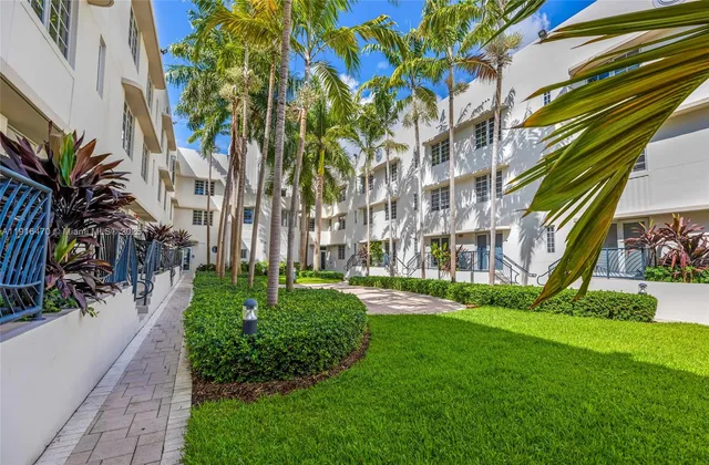 a lobby with furniture and a large window