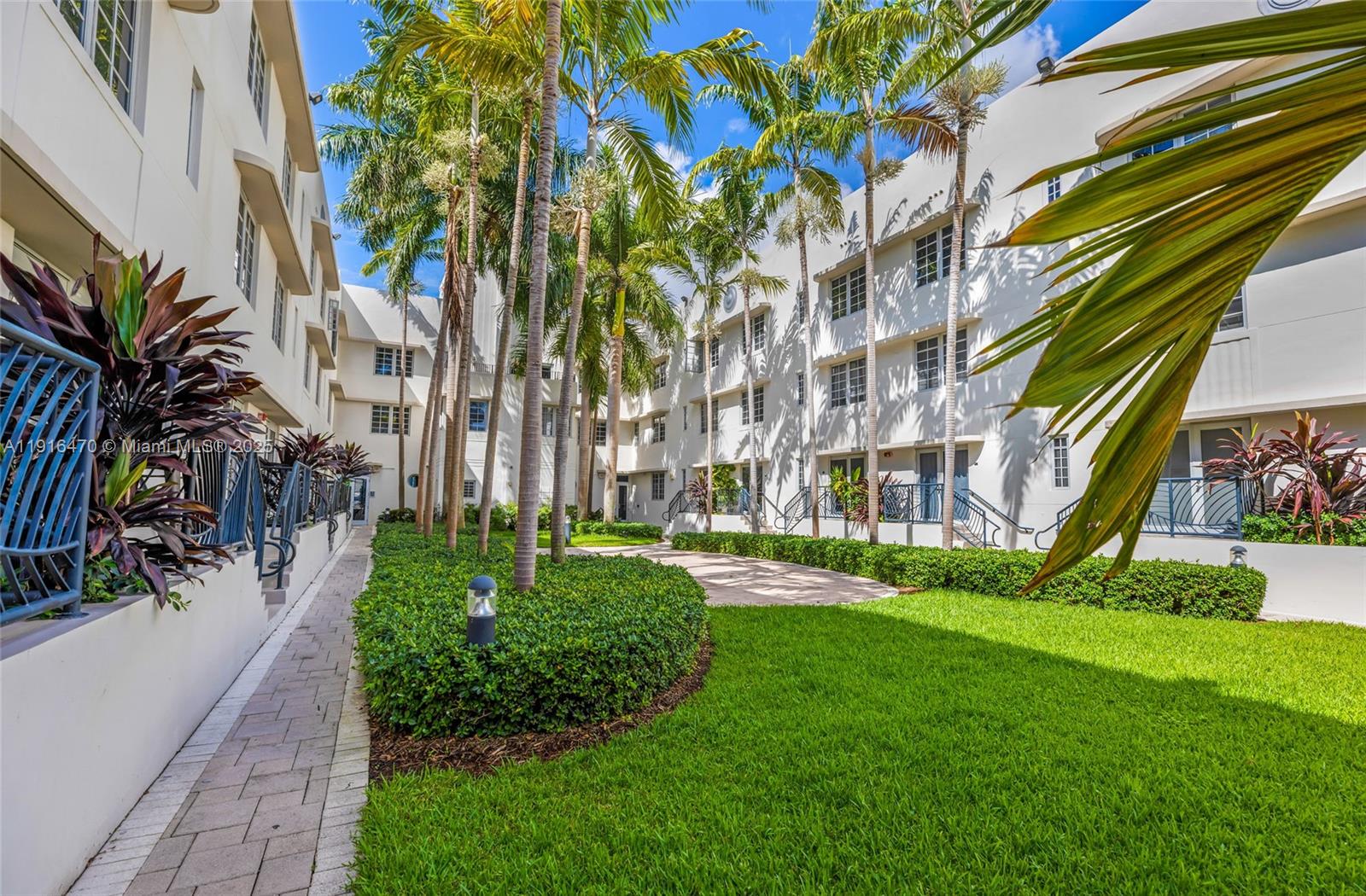 435 21st Street, Unit 311 Miami Beach, FL 33139 - Photo 36 of 40 a view of a building with a yard