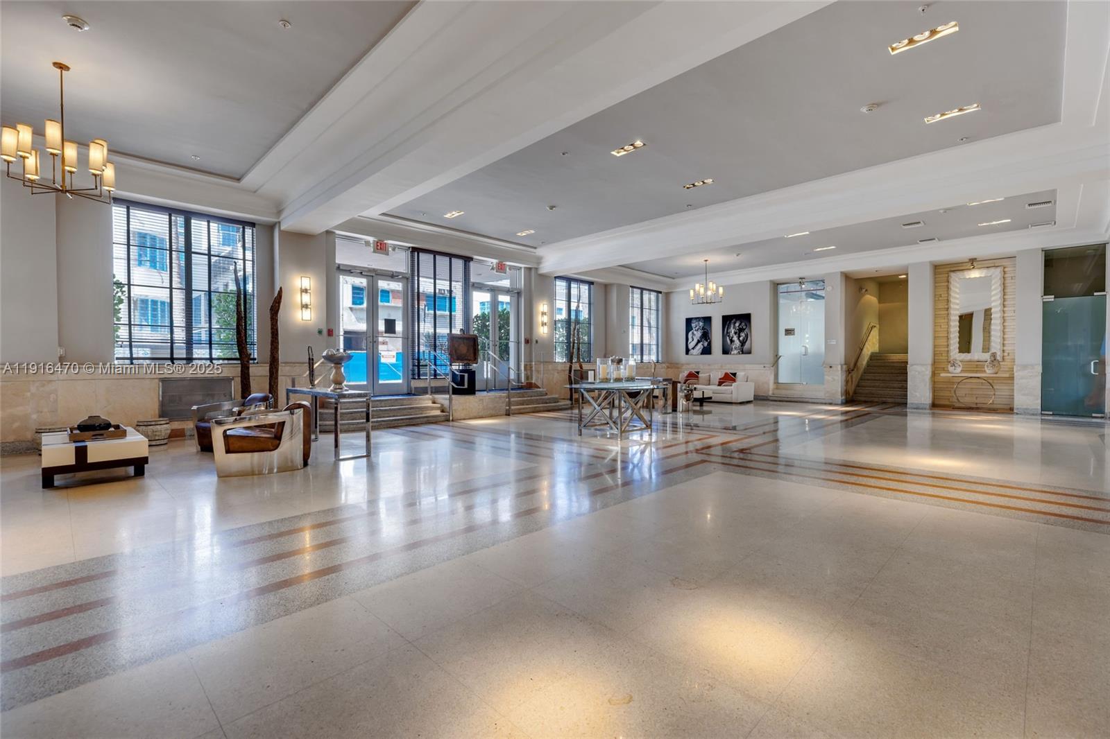 435 21st Street, Unit 311 Miami Beach, FL 33139 - Photo 37 of 40 a lobby with furniture and a large window