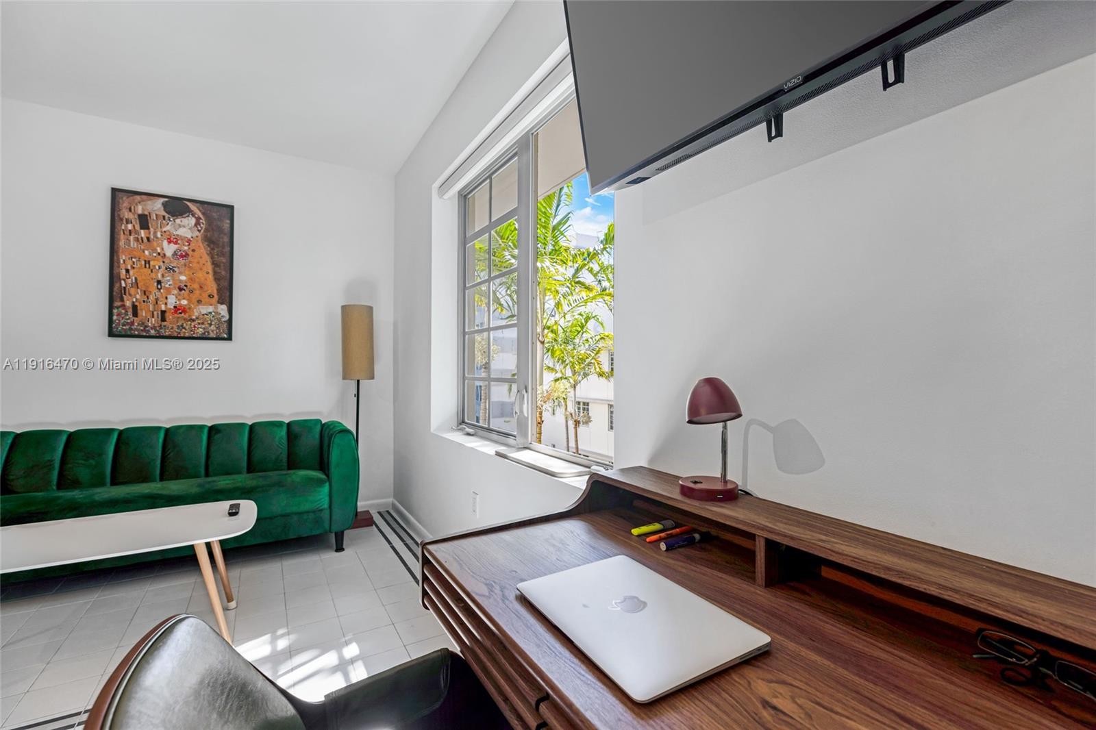 435 21st Street, Unit 311 Miami Beach, FL 33139 - Photo 8 of 40 a living room with furniture and a window