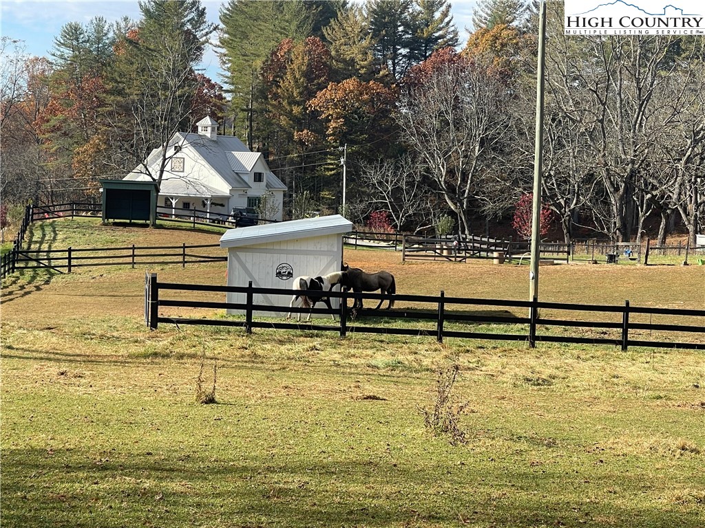 Lot 20 River Aspen Road, Unit 20 McGrady, NC 28649 - Photo 7 of 13 a view of a swimming pool with a chair