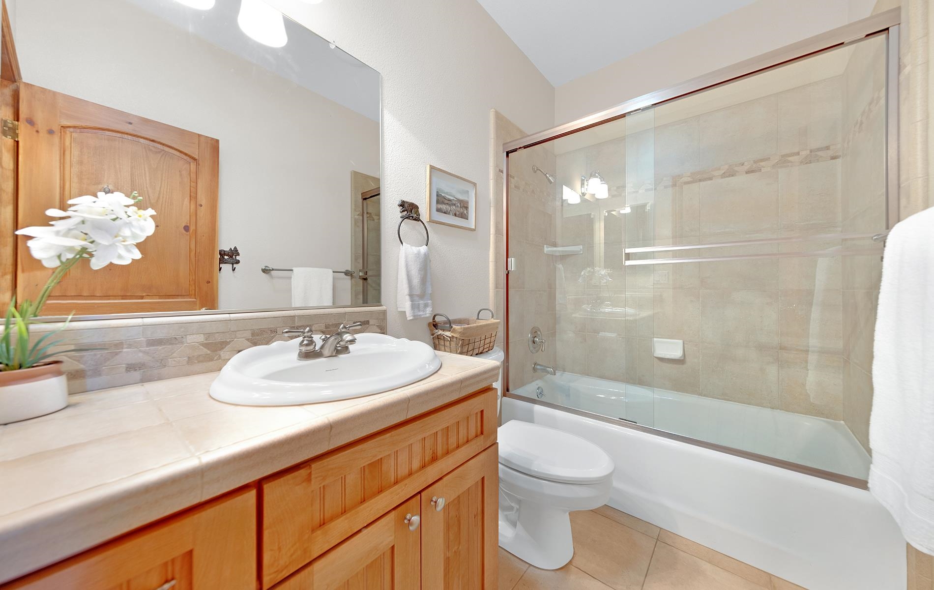 627 Deep Forest Road Lake Almanor, CA 96137 - Photo 21 of 29 a bathroom with a sink a toilet and shower