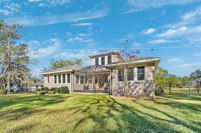 a view of a house with a big yard
