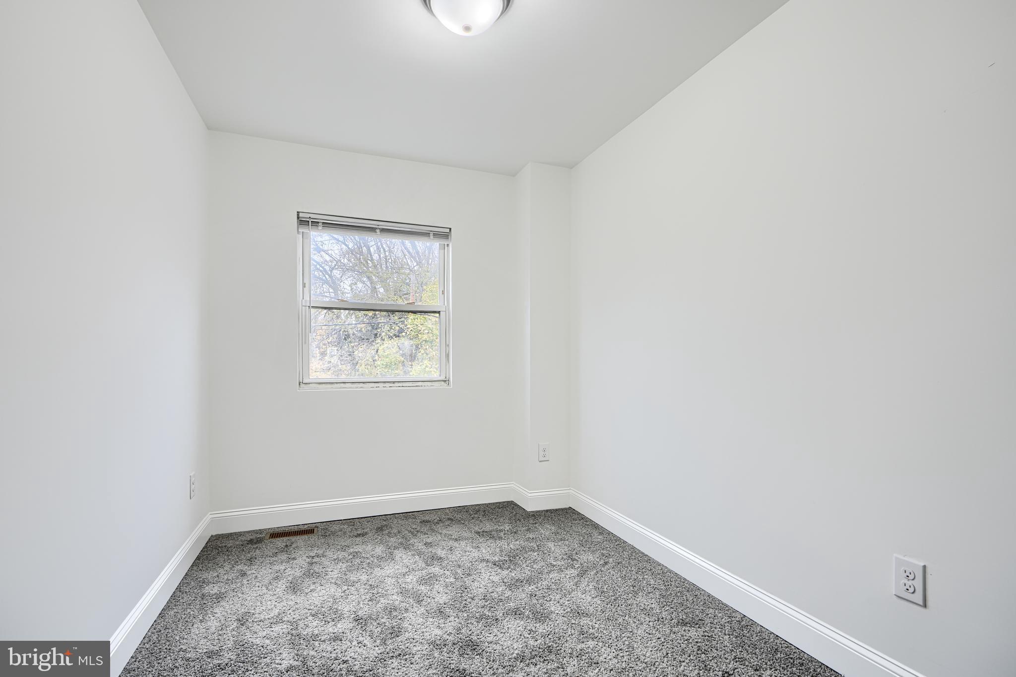 718 Benninghaus Road Baltimore, MD 21212 - Photo 23 of 40 an empty room with a window