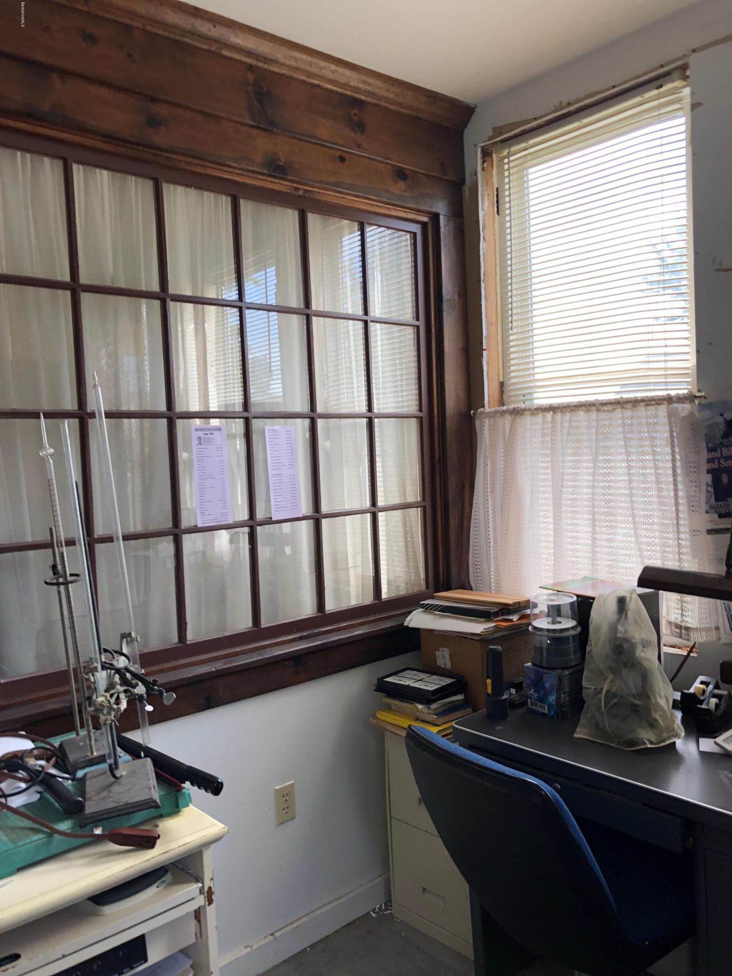 160 High Street Lee, MA 01238 - Photo 12 of 16 a kitchen with a sink and a stove next to a window