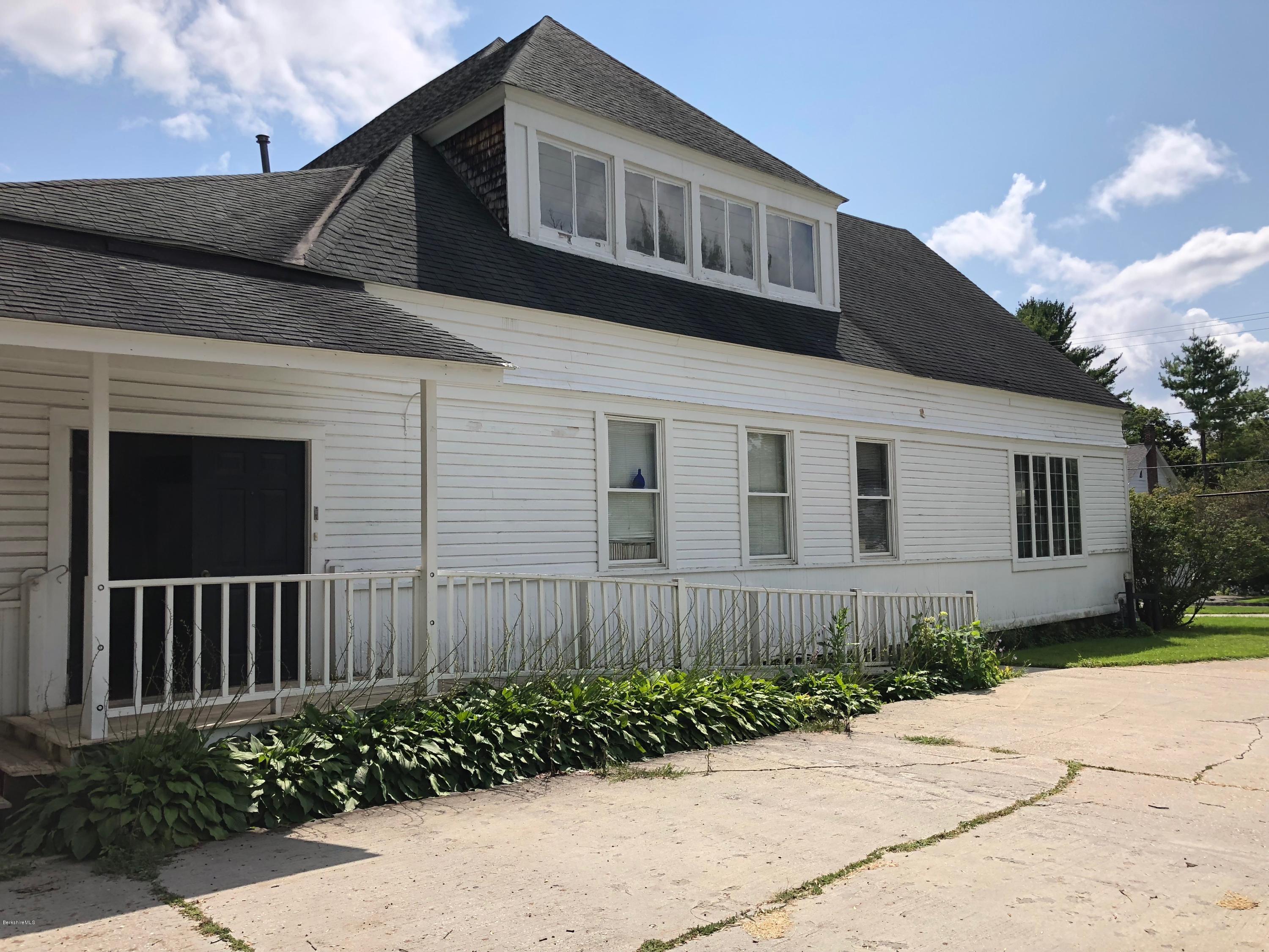 160 High Street Lee, MA 01238 - Photo 15 of 16 a front view of a house with a garden