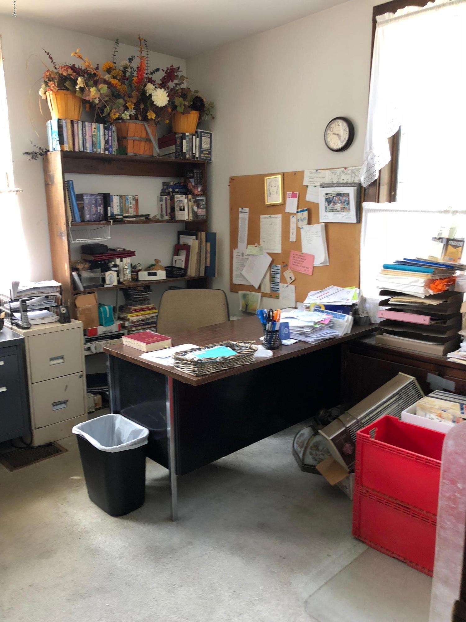 160 High Street Lee, MA 01238 - Photo 8 of 16 a room with a couch and a table